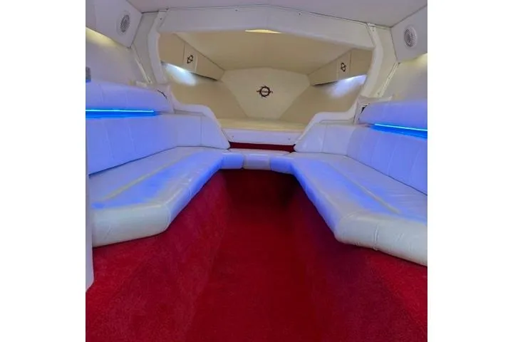 Slide: The Image of Interior of a 2000 Fountain 47 Lightning boat with white seating and red carpet. - 45