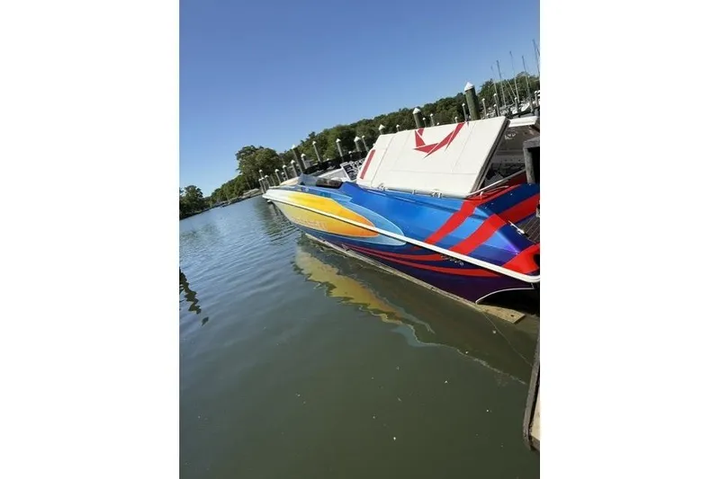 Slide: The Image of Colorful 2000 Fountain 47 Lightning speedboat docked on a sunny day. - 9