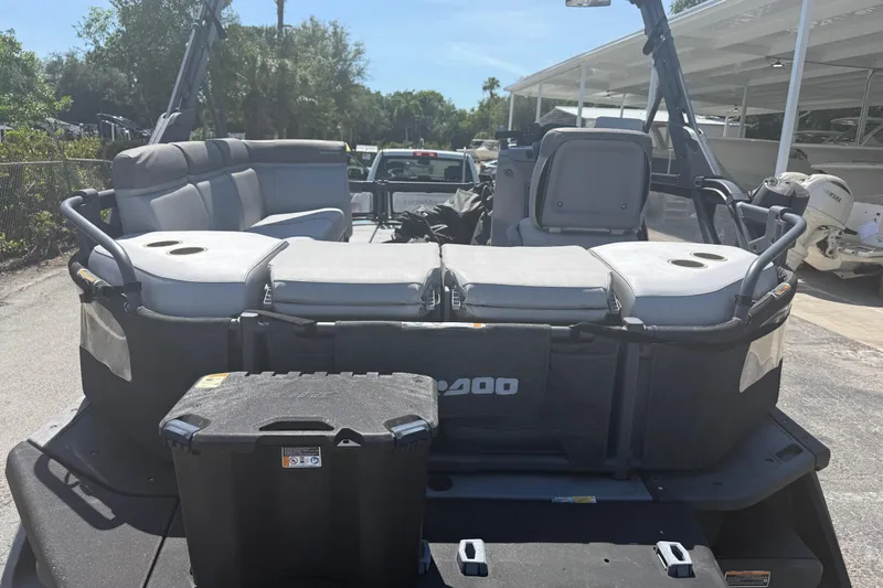 Slide: The Image of 2022 Sea-Doo Switch Sport 18 pontoon boat with spacious seating and storage. - 8