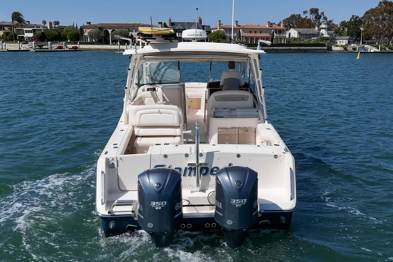 Slide: The Image of 2016 Grady-White Freedom 335 boat with twin Yamaha 350 engines on the water. - 11