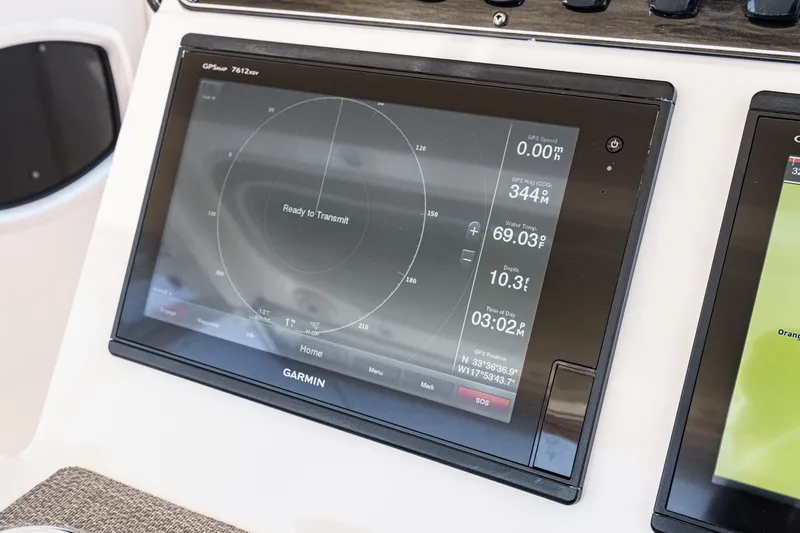Slide: The Image of Garmin GPS display on 2016 Grady-White Freedom 335 boat, showing navigation and environmental data. - 21
