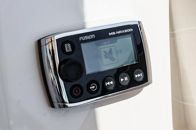 Slide: The Image of Fusion MS-NRX200i marine stereo control on 2016 Grady-White Freedom 335 boat. - 23