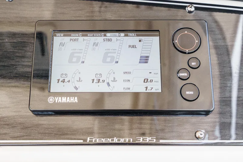 Slide: The Image of Yamaha display panel on 2016 Grady-White Freedom 335 boat dashboard. - 26