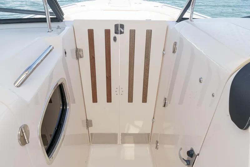 Slide: The Image of 2016 Grady-White Freedom 335 boat interior with wooden accents and sleek design. - 28