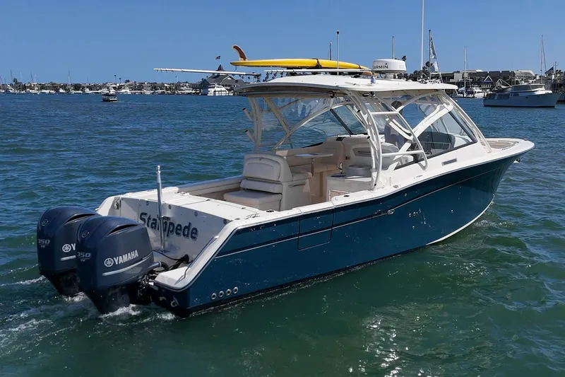 Slide: The Image of 2016 Grady-White Freedom 335 boat with dual Yamaha engines on the water. - 7