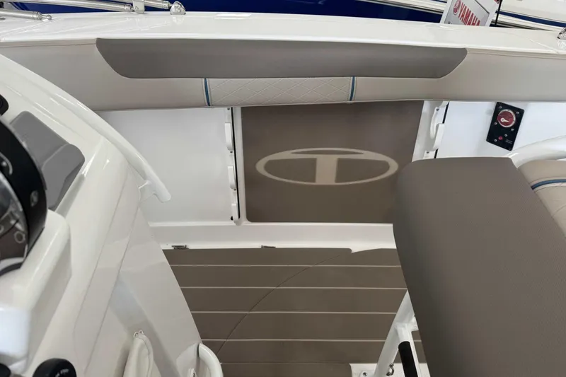 Slide: The Image of 2026 Tahoe 2150 CC boat interior with sleek seating and modern design elements. - 4