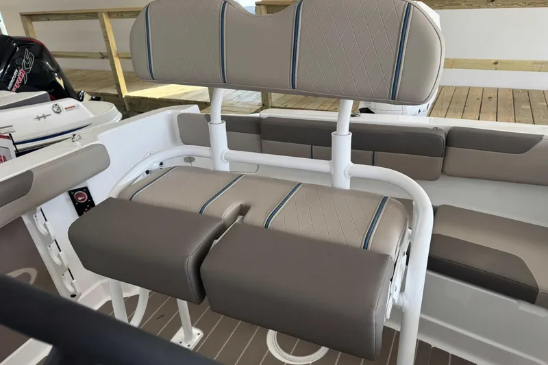 Slide: The Image of 2026 Tahoe 2150 CC boat interior with cushioned seating and modern design. - 6