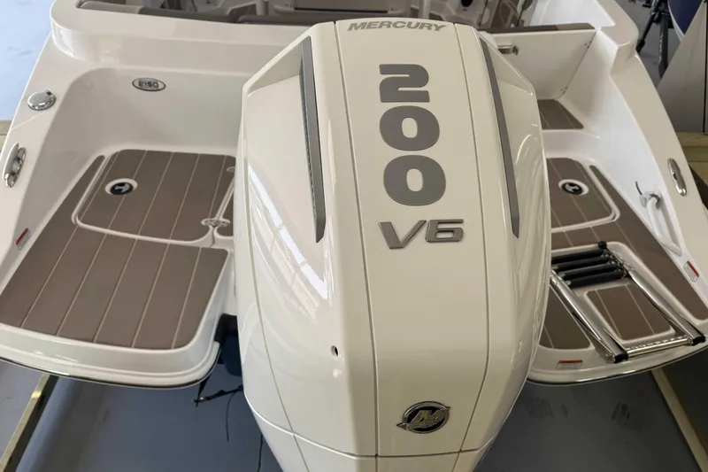 Slide: The Image of 2026 Tahoe 2150 CC boat with Mercury 200 V6 engine, featuring sleek design and spacious deck. - 9