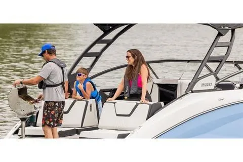 Slide: The Image of Family enjoying a day on a 2026 Yamaha Boats 252SD. - 12