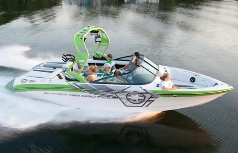 The Image of Manufacturer Provided Image: 2013 Nautique Super Air Nautique 230 speedboat cruising on a lake with passengers. - 0