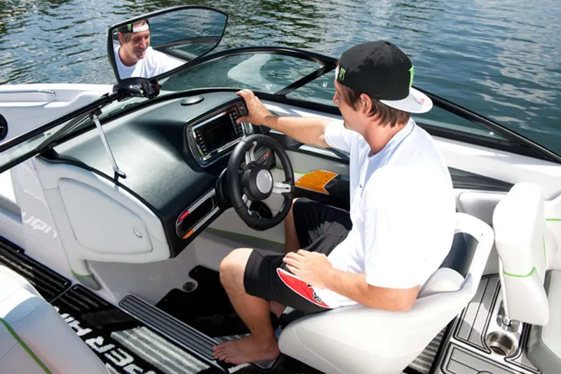 Slide: The Image of Manufacturer Provided Image: Man operating 2013 Nautique Super Air Nautique 230 boat on water. - 5