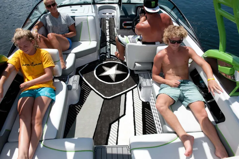 Slide: The Image of Manufacturer Provided Image: People relaxing on a 2013 Nautique Super Air Nautique 230 boat. - 7