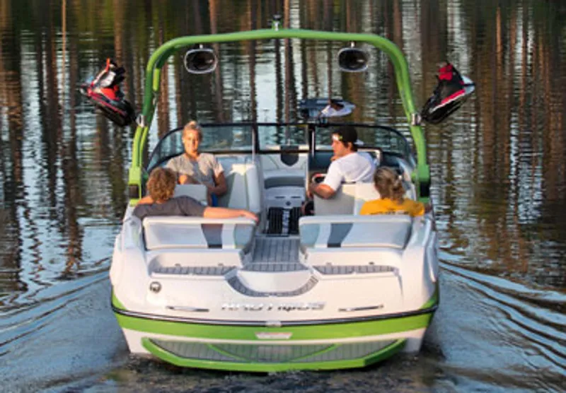 Slide: The Image of Manufacturer Provided Image: 2013 Nautique Super Air Nautique 230 boat with passengers on a lake. - 9