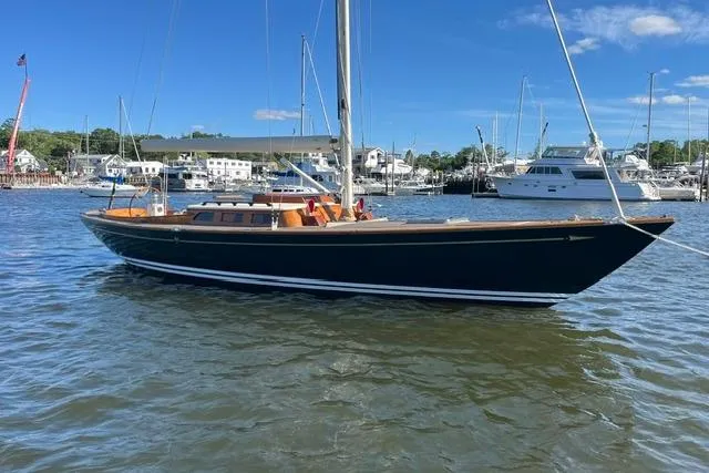 Slide: The Image of Sailboat Morris 36, 2006 model, docked in a marina with clear skies. - 10