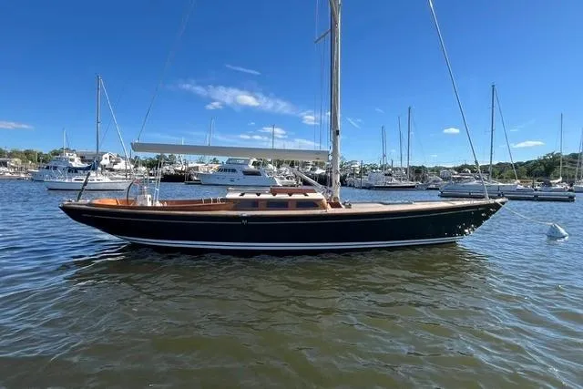 Slide: The Image of Sailboat on water, Morris 36 model, 2006, docked in a marina under clear blue sky. - 11