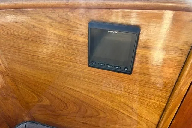 Slide: The Image of Garmin device mounted on wooden panel of 2006 Morris 36 boat interior. - 22