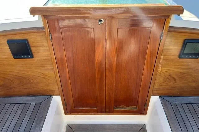 Slide: The Image of Wooden cabin door on a 2006 Morris 36 boat, featuring elegant teak finish. - 23