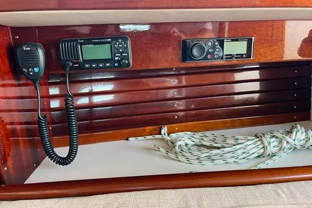 Slide: The Image of Wooden boat interior with communication devices and coiled rope, Morris 36, 2006 model. - 27