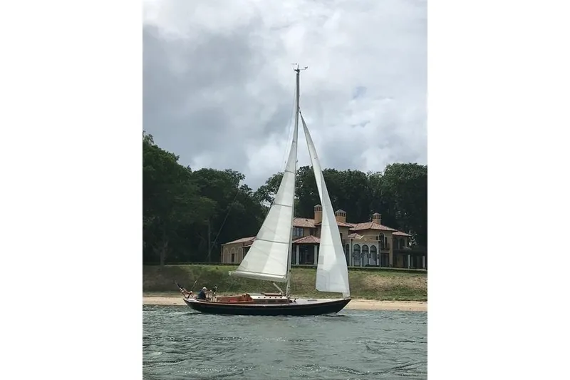Slide: The Image of Sailboat on water near a large house, Morris 36 model, 2006. - 3