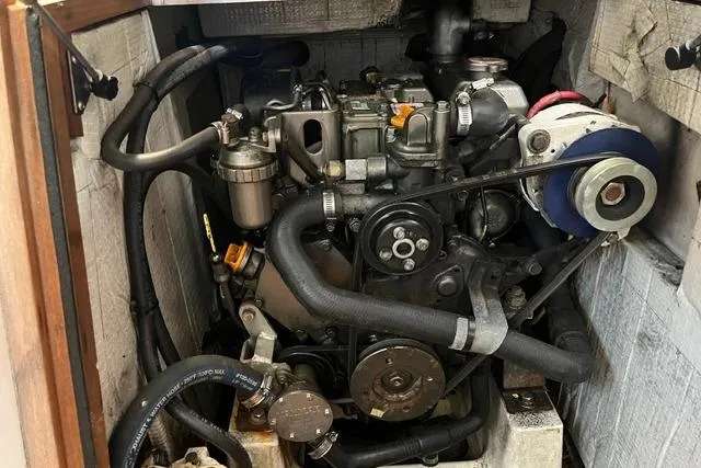 Slide: The Image of Engine compartment of a 2006 Morris 36, showcasing mechanical components and hoses. - 32