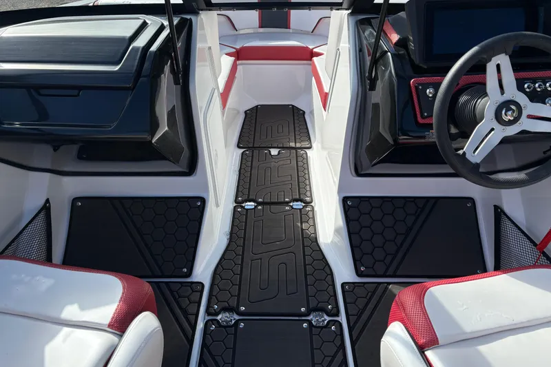 Slide: The Image of Interior of 2023 Scarab 215 ID boat with modern dashboard and seating. - 16