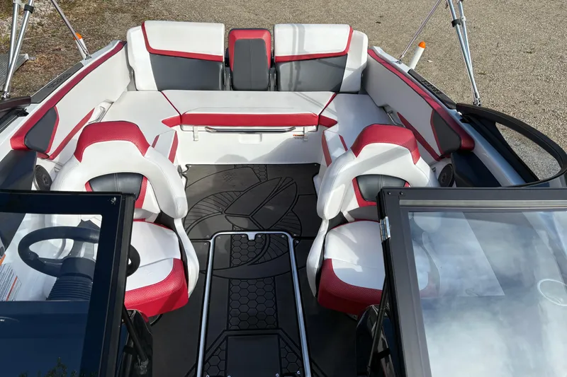 Slide: The Image of Interior of 2023 Scarab 215 ID boat with red and white seating, modern design. - 21