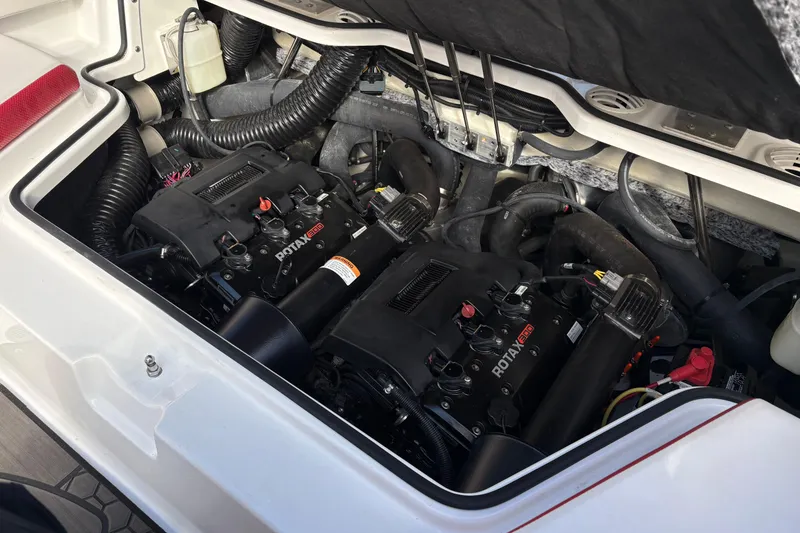 Slide: The Image of Engine compartment of 2023 Scarab 215 ID boat with Rotax engines visible. - 23