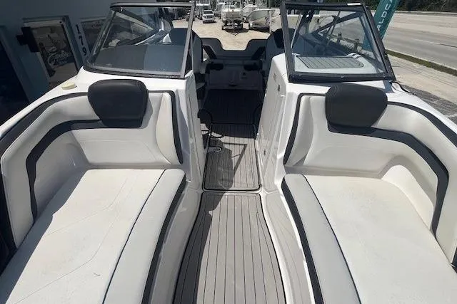 Slide: The Image of 2022 Yamaha 242SE boat interior with sleek seating and modern design. - 6
