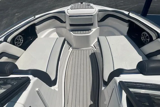 Slide: The Image of 2022 Yamaha 242SE boat interior with sleek seating and modern design. - 4