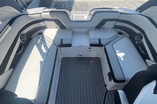 Slide: The Image of 2022 Yamaha 242SE boat interior with sleek seating and modern design. - 8