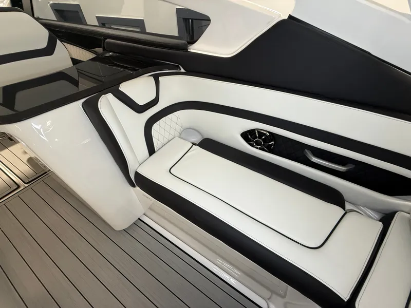 Slide: The Image of Interior of a modern boat with sleek white and black seating and a table. - 17
