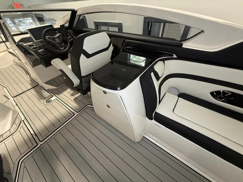 Slide: The Image of The image shows the modern cockpit and seating of a 2026 Yamaha 275SD boat. - 15