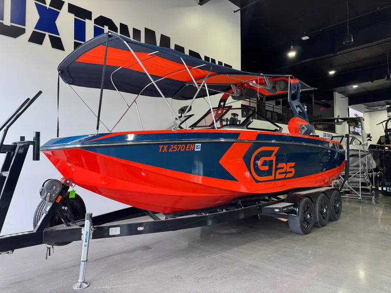 Slide: The Image of 2019 Nautique Super Air Nautique G25 boat in showroom. - 3