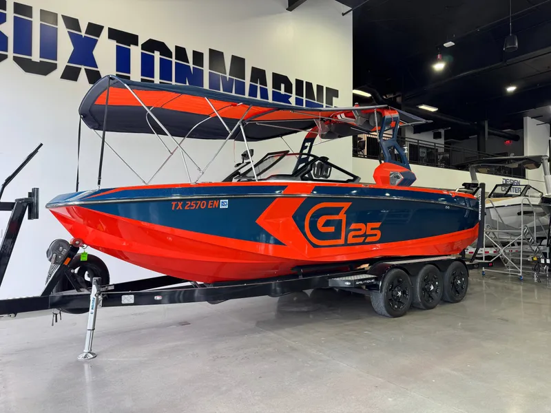 Slide: The Image of 2019 Nautique Super Air G25 boat in showroom. - 4