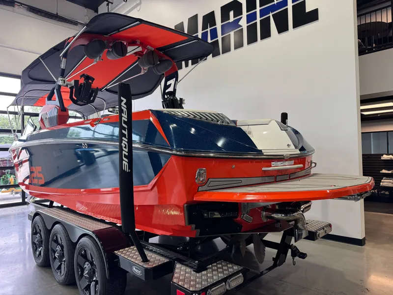 Slide: The Image of 2019 Nautique Super Air Nautique G25 boat in showroom. - 6