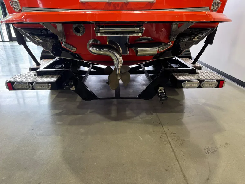 Slide: The Image of Rear view of a 2019 Nautique Super Air Nautique G25 boat on trailer. - 8