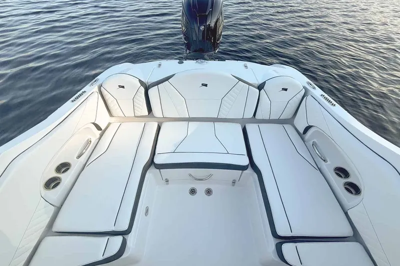 Slide: The Image of Interior of 2026 Stingray 23 OSX with luxurious white seating. - 10