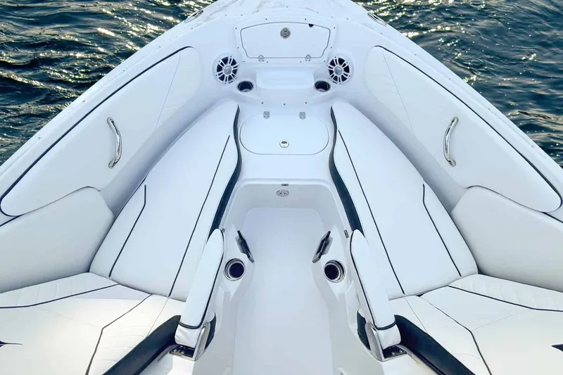 Slide: The Image of Interior view of 2026 Stingray 23 OSX boat on water. - 3