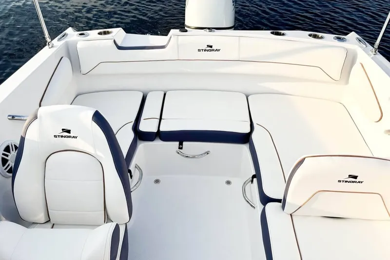 Slide: The Image of Interior of 2026 Stingray 172 DC boat with white seating. - 2
