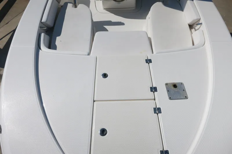 Slide: The Image of 2018 Robalo 246 Cayman boat deck with storage compartments and seating. - 19