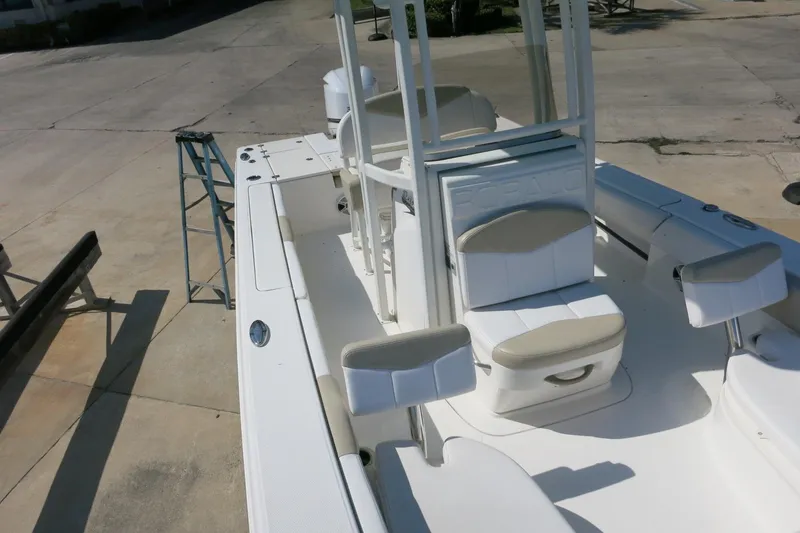Slide: The Image of 2018 Robalo 246 Cayman boat interior with white seating and console. - 21