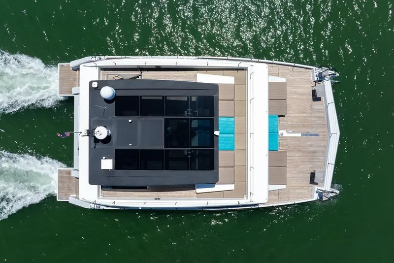 Slide: The Image of Overhead view of 2018 Sunreef 68 Supreme yacht cruising on green water. - 10
