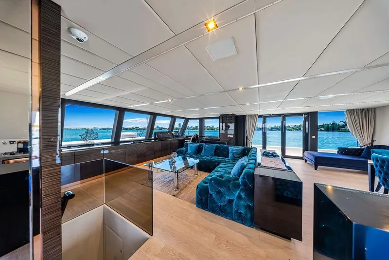 Slide: The Image of Luxurious interior of 2018 Sunreef 68 Supreme yacht with panoramic windows and plush seating. - 22