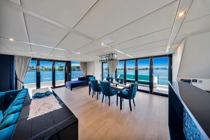 Slide: The Image of Luxurious interior of 2018 Sunreef 68 Supreme yacht with elegant dining area and panoramic windows. - 23