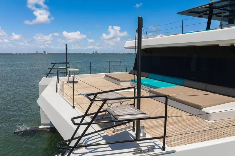 Slide: The Image of Luxurious 2018 Sunreef 68 Supreme yacht deck with sun loungers and ocean view. - 7