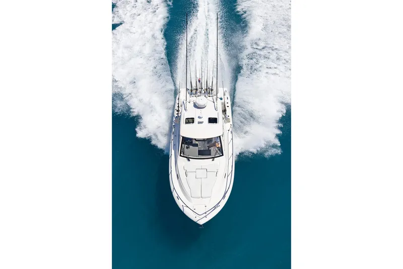 Slide: The Image of 2026 Pursuit OS 325 Offshore boat cruising on clear blue water. - 4