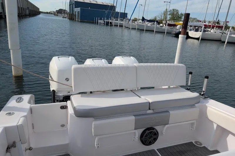 Slide: The Image of 2018 Fountain 38 Center Console boat with triple engines docked at marina. - 11