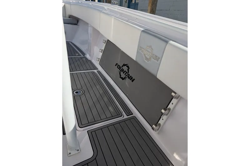 Slide: The Image of 2018 Fountain 38 Center Console boat interior with branded flooring and seating. - 12