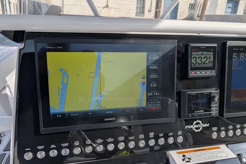 Slide: The Image of Dashboard of a 2018 Fountain 38 Center Console with Garmin GPS and controls. - 15