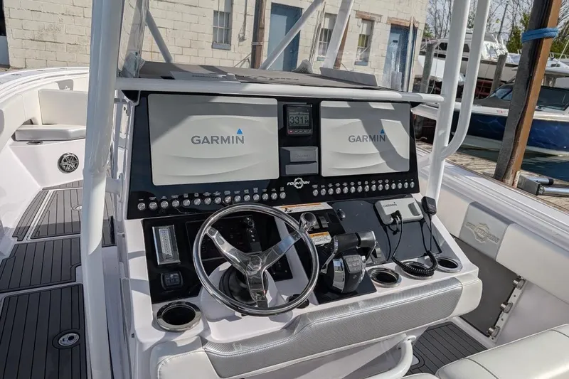 Slide: The Image of 2018 Fountain 38 Center Console boat dashboard with Garmin navigation system. - 5